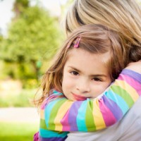 Child hugging Mom